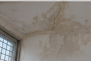 Guntur waterproofing before — water seepage stains and cracks on ceiling and wall